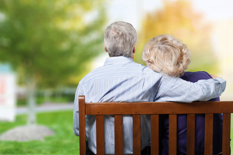 elderly couple on a bench